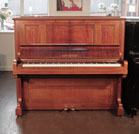 Reconditioned, 1924, Bechstein model 8 upright piano with a rosewood case and brass fittings. Piano has an eighty-eight note keyboard and two pedals