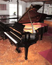 Reconditioned, 2008, Steinway Model B Steinway Model B grand piano for sale with a black case and spade leg. Piano has an eighty-eight note keyboard and a three-pedal lyre