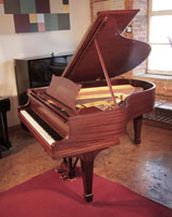 Rebuilt, 1929, Steinway Model M grand piano for sale with a satin, mahogany case and matching stool. Piano has an eighty-eight note keyboard and a two-pedal lyre.