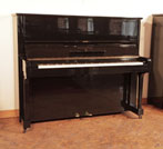 Reconditioned, 1939, Steinway Model V upright piano for sale with a black case and brass  and brass fittings. Piano has an eighty-eight note keyboard and two pedals 