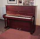 Reconditioned, 1986, Bechstein model 11 upright piano with a satin mahogany case and brass fittings