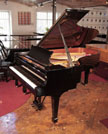 Reconditioned, 2006, Steinway Model B Steinway Model B grand piano for sale with a black case and spade legs
