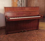 Reconditioned, 1968, Steinway Model F upright piano for sale with a walnut case and brass fittings. Piano has an eighty-eight note keyboard and two pedals 